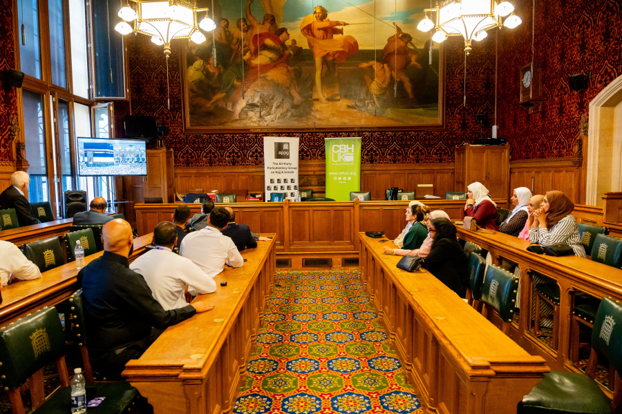 Guests watch the screening of Human Tide during the APPG on Hajj & Umrah meeting in a parliamentary committee room at the Palace of Westminster.
